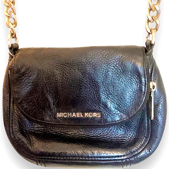 Michael Kors Handbags - Michael Kors black leather small purse.in excellent pre owned condition.